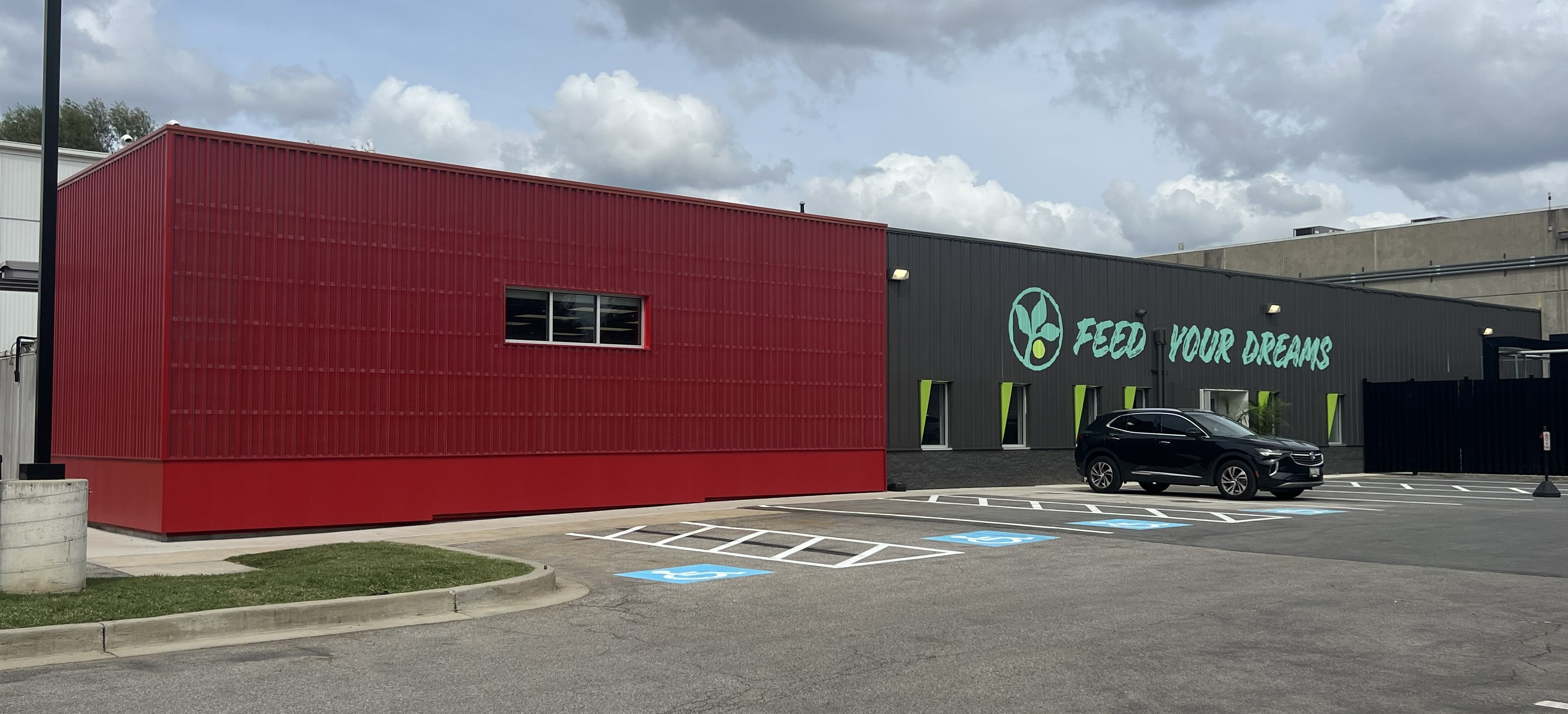 ATAS perforated screen over single skin panel at food bank